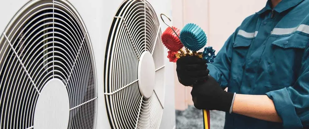 Person (looking clueless) checking an HVAC system