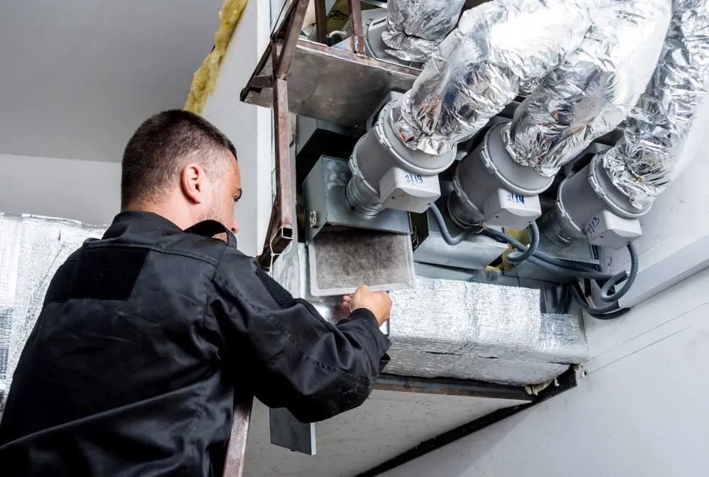 Cold Factor technician cleaning HVAC ductwork