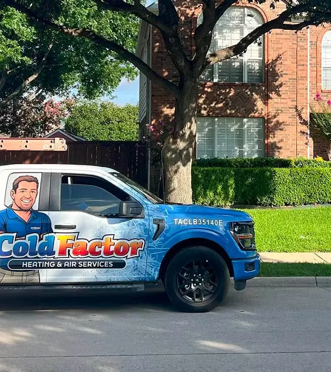 Cold Factor Heating and Air Services branded service truck parked in front of a brick home in a Flower Mound TX neighborhood