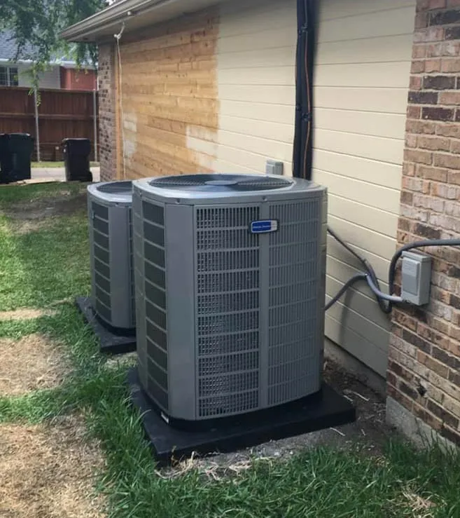 Two American Standard outdoor AC condenser units installed at a residential property in Lewisville TX -- Cold Factor HVAC