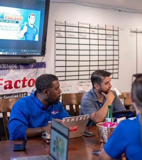 Cold Factor Heating and Air Services team meeting with branded materials and TACLB license visible -- Cold Factor HVAC Flower Mound TX