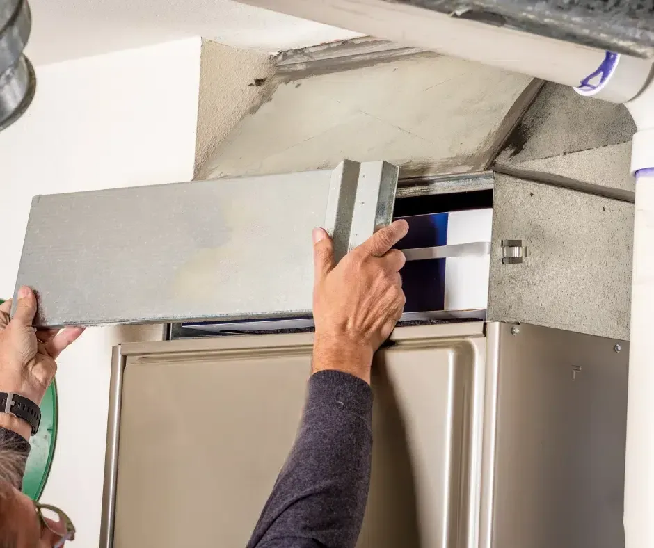 hvac professional technician working on unit