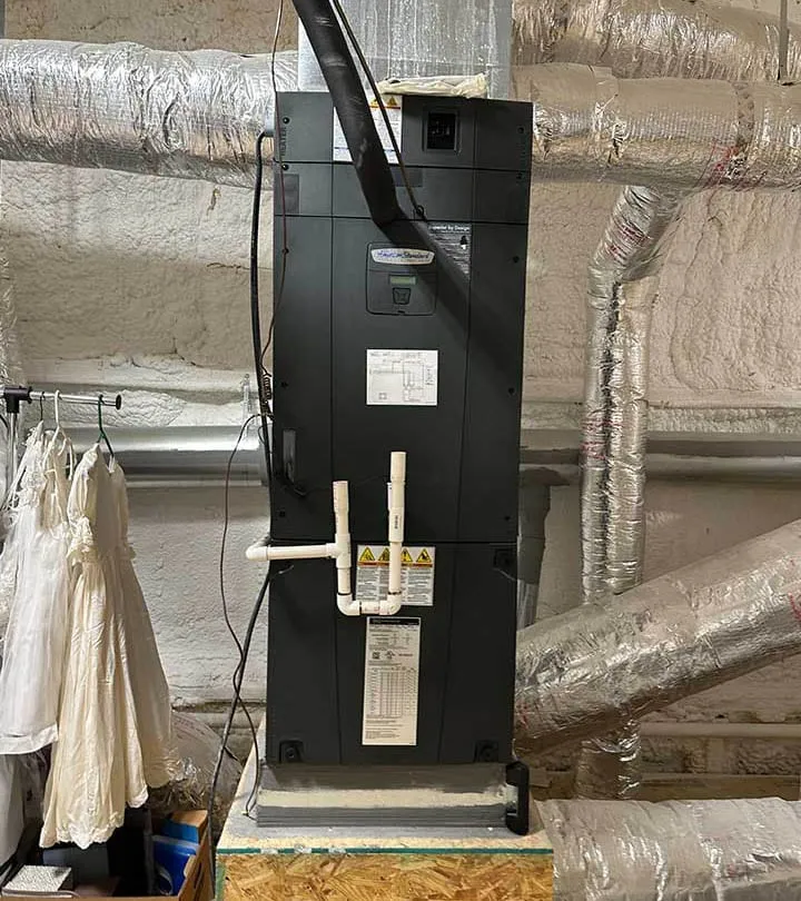 American Standard furnace installed in a utility room with connected ductwork -- Cold Factor HVAC heating installation