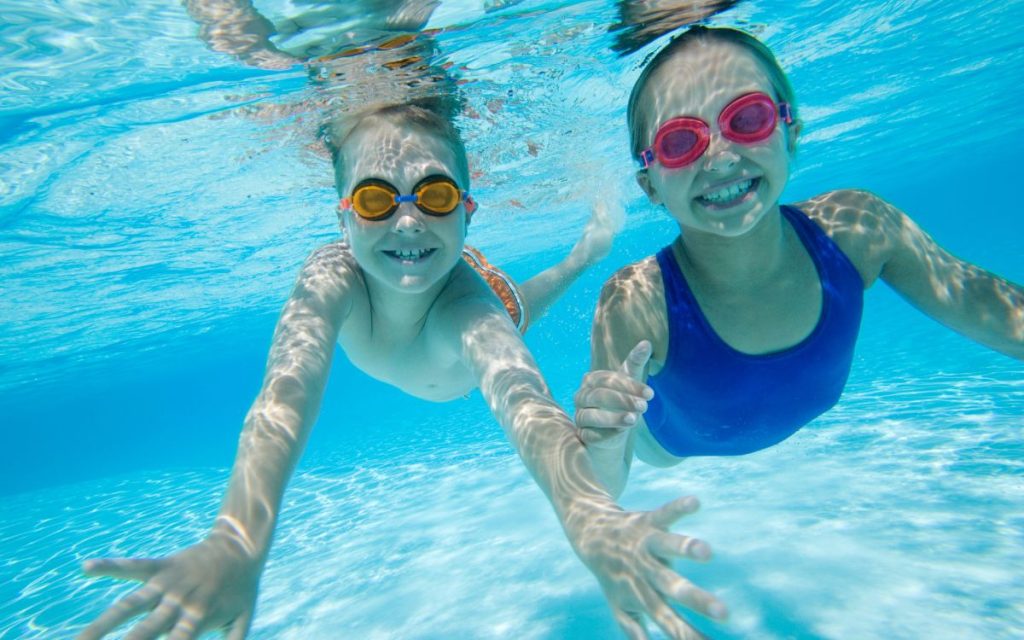 kids swimming in pool in lewisville