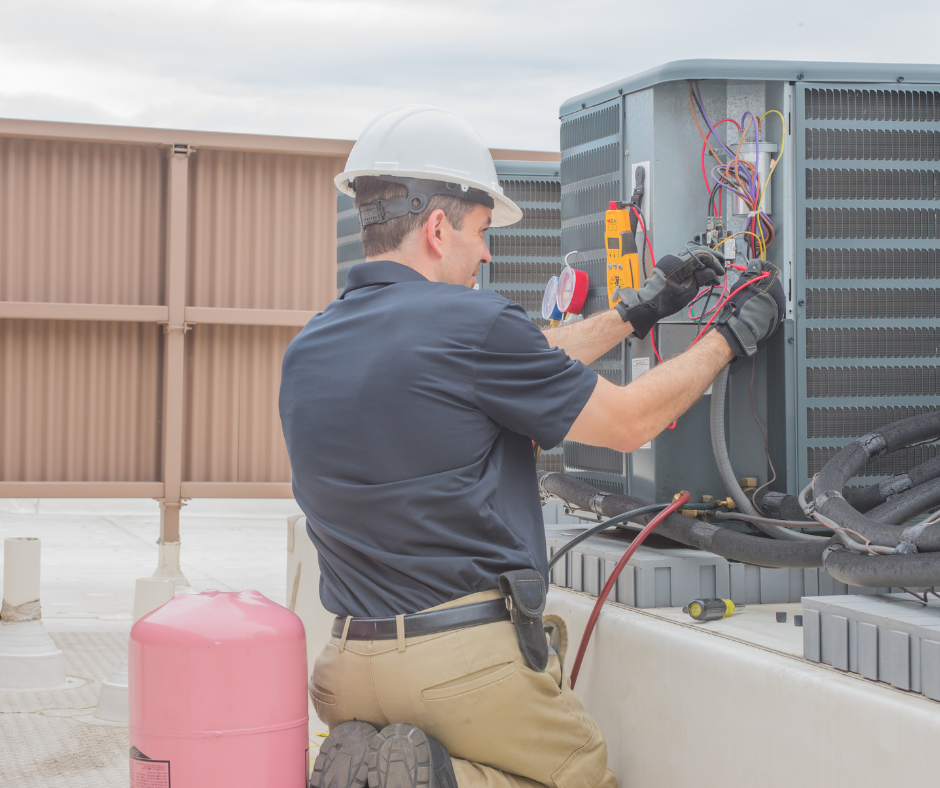 hvac professional technician working on unit