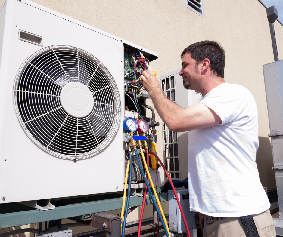 hvac professional technician working on unit