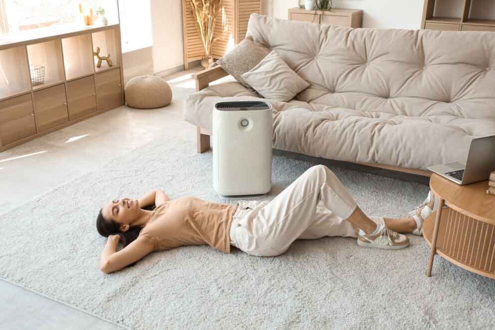 woman lying on floor near purifier Flower Mound, TX