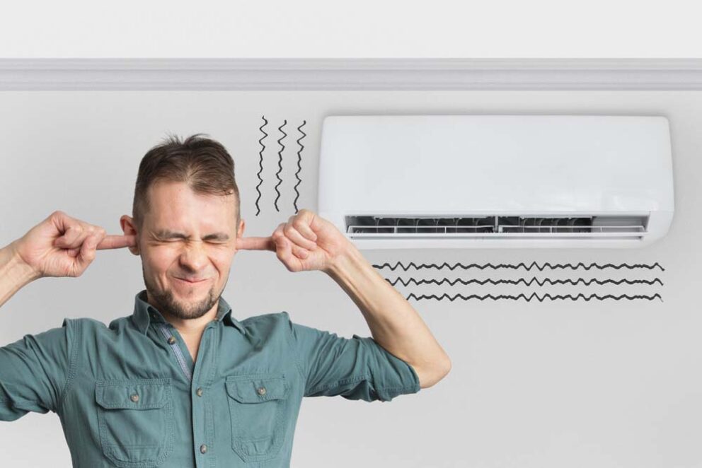 person pressing their ear onto an AC unit