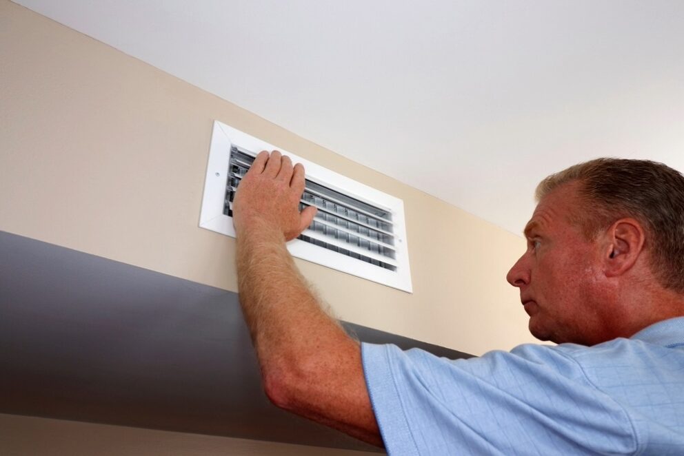 hand hovering over AC vents
